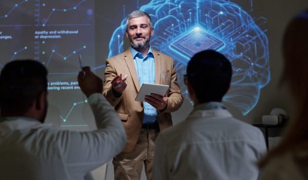 smiling-mature-speaker-answering-questions-brain-research (2)